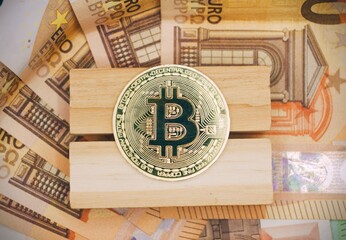 Bitcoin over euros banknotes concept of crypto currency .