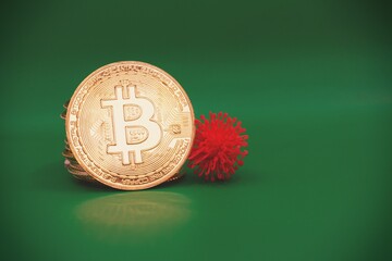 Bitcoin with a virus cell in a green background .