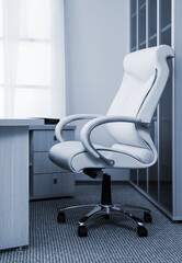 white leather armchair in modern office - 516310869