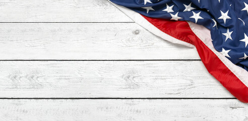 Flat lay USA flag on white wooden board, vintage background with copy space top view. Banner,...