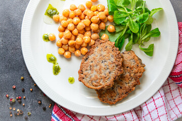 chickpeas vegetable cutlets lentils, lettuce fresh healthy meal food snack diet on the table copy space food background rustic top view keto or paleo diet veggie vegan or vegetarian food