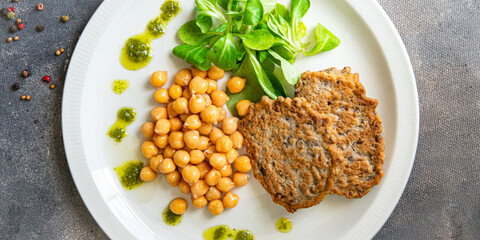 chickpeas vegetable cutlets lentils, lettuce fresh healthy meal food snack diet on the table copy space food background rustic top view keto or paleo diet veggie vegan or vegetarian food