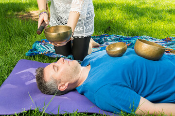 Man during a singing bowl session.