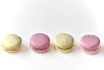 Delicious multicolored almond cookies isolated on a white background. Sweet multicolored macaroons.