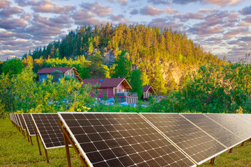 Solar panels. Solar power plant near houses. Solar panels for cottage settlement. Renewable...