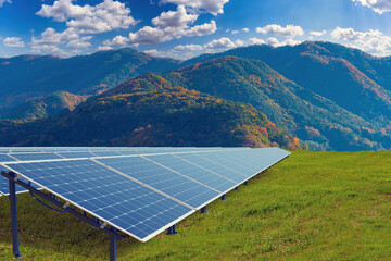 Renewable technologies. Solar panels at foot mountains. Solar panels are directed to sky....