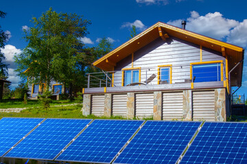 Solar panels. Panels for collecting regenerative energy. Farm from solar panels in cottage village....