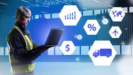 Logistic man. Employee of transport company with laptop. Choosing method of transporting goods. Gray-haired man with computer. Human in yellow vest in empty hangar. Career in logistics business