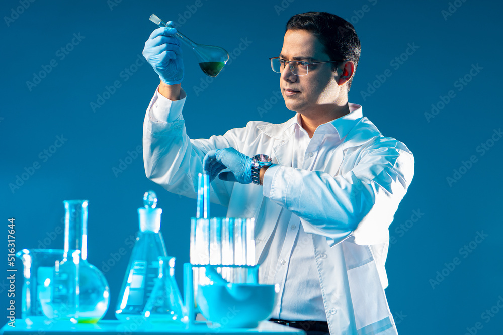 Poster man laboratory assistant. lab worker with flasks. doctor holds test tube with tests. laboratory assi