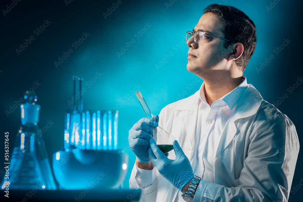 Wall mural laboratory technician. man in white coat. human in laboratory. guy with test tube. proud laboratory 