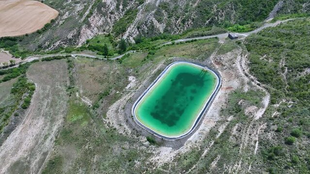 Irrigation pond in the town of Bailo seen from a drone. The Jacetania. Huesca, Aragon, Spain, Europe