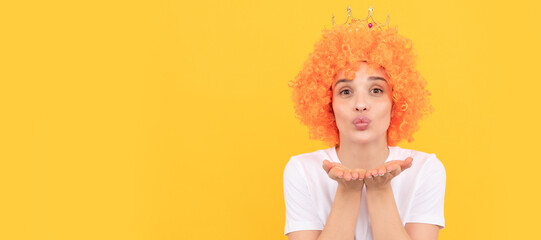 blow a kiss. funny girl in diadem. selfish woman in tiara. pageant. april fools day. freaky girl. Woman isolated face portrait, banner with copy space.