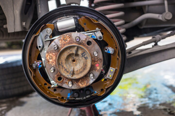 Maintenance repair and cleaning drum brake and asbestos brake pads it's a part of car use for stop...