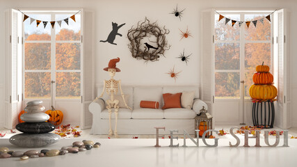 White table shelf with pebble balance and 3d letters making the word feng shui over Halloween living room with sofa and window with autumnal landscape, zen concept interior design