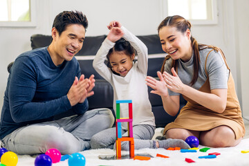 Portrait of enjoy happy love asian family father and mother with little asian girl smiling activity...