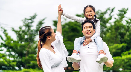 Portrait of enjoy happy love asian family father and mother holding cute little asian girl child...