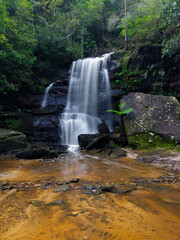 Rocky cascade waterfall in the rainforest.