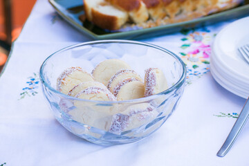 Traditional Argentinian cornstarch Alfajores with dulce de leche and coconut. Argentine gastronomy concept.