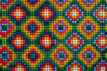 Fototapeta na wymiar Drawing of Plastic Caps. Combination of Rhombus Patterns. Caps Laid out in Mexican Ornament