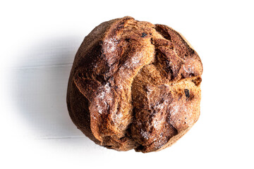 Round bread close-up on white background. Freshly baked sourdough bread with a golden crust. Baker shop context with delicious bread.