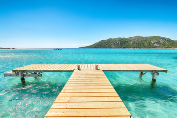 Amazing landscape with wooden pier on Santa Giulia beach.