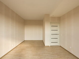 An empty bedroom with a budget clean renovation in a new apartment