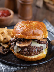 Mushroom cheeseburger on a toasted bun