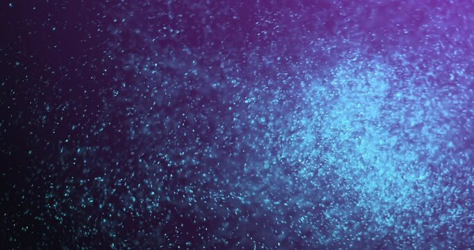 Animation of blue glitter moving on violet background