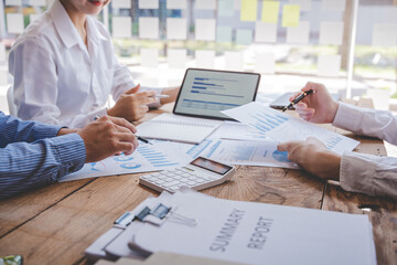 Young colleagues having great business conversations in a modern coworking office. Teamwork concept. Horizontal blurry background. Fireworks.