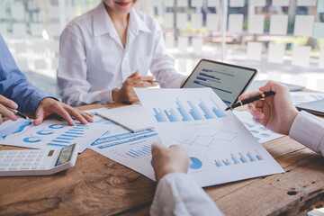 Young colleagues having great business conversations in a modern coworking office. Teamwork concept. Horizontal blurry background. Fireworks.