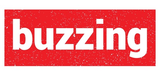 buzzing text written on red stamp sign.