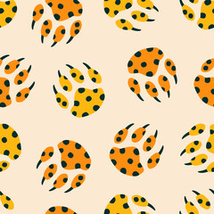 Colorful paws of wild big cat hand drawn vector illustration.Vintage leopard print seamless pattern for fabric or wallpaper.