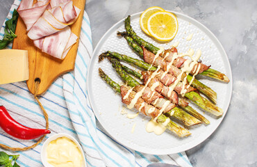 Grilled green asparagus wrapped with bacon. Ketogenic diet. Healthy food, diet menu. Top view