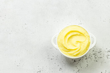 Creamy mashed cauliflower in a bowl. Top view, copy space, flat lay.