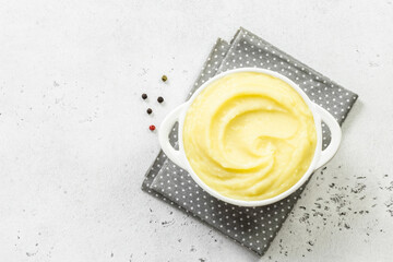 Creamy mashed potatoes in a bowl. Top view, copy space, flat lay.