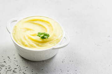 Creamy butter potato mash in a bowl. Top view, copy space, flat lay.