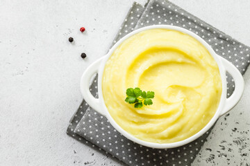 Roasted garlic mashed cauliflower in a bowl. Top view, copy space, flat lay.