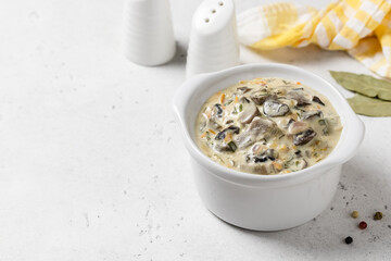 Creamy vegetable mushroom sauce in pot. Top view, copy space.