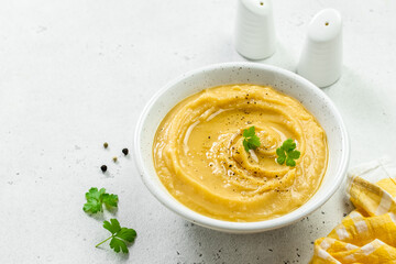 Mashed split pea with herbs and olive oil. Top view, copy space, flat lay.