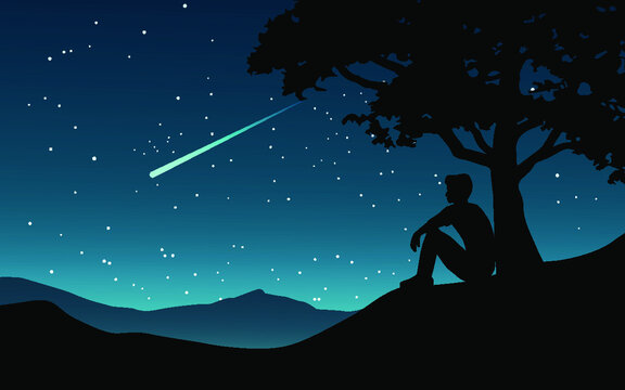 silhouette of a boy on the night sky