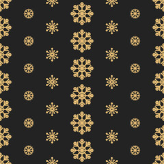 Christmas snow background. Golden snowflakes on a black background. Winter seamless pattern.