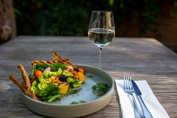 Fresh vegetable salad of tomatoes, cucumbers, italian mix, lettuce.