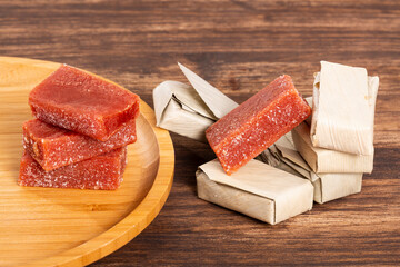Guava Paste Wrapped in Bijao Leaf; Photo On Wood Background