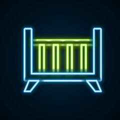 Glowing neon line Baby crib cradle bed icon isolated on black background. Colorful outline concept. Vector