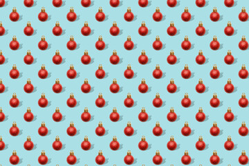 Christmas New Year holiday creative minimal seamless pattern bluebackground with red baubles balls decorations, ornaments, Flat lay, top view