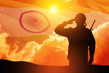 Silhouette of soldier saluting on a background of India flag and the sunset or the sunrise. Greeting card for Independence day, Republic Day. India celebration.