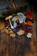 minerals and magic things on dark wooden background. witchcraft ritual for autumn holidays,...