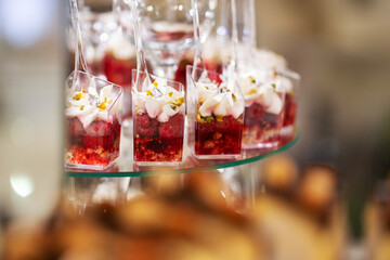 Fresh, appetizing, sweet, desserts close up on a decorated festive buffet table