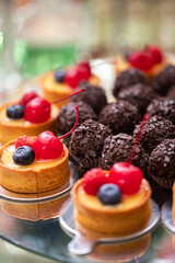 Fresh, appetizing, sweet, desserts close up on a decorated festive buffet table