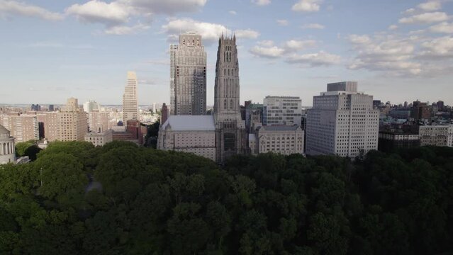Aerial view in front of the Riverside Church, summer in NYC, USA - ascending, tilt drone shot
